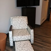 cushioned chair with leg rest