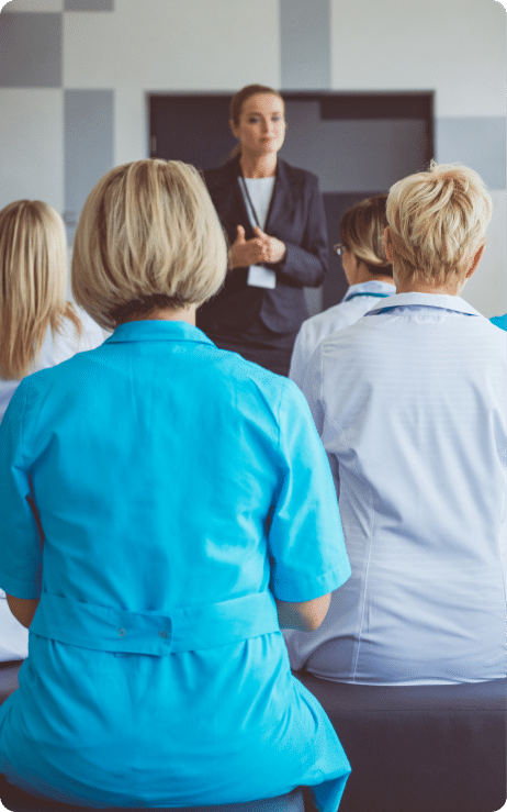 woman presenting to a crowd