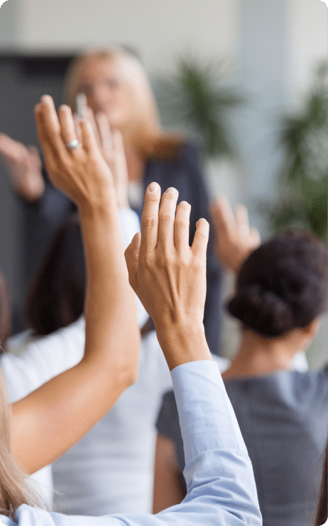 people in a crowd raising a hand