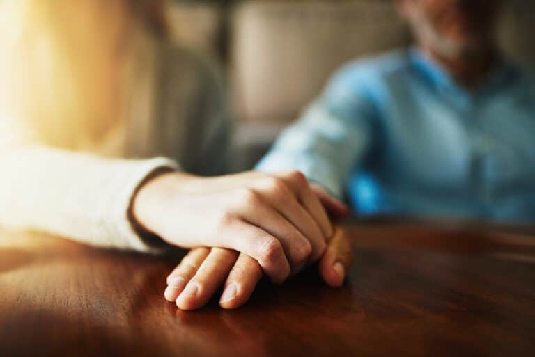 Hands Holding in Grief
