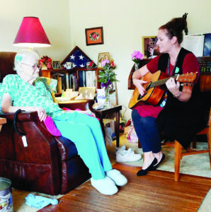 Woman Playing Guitar with Patient