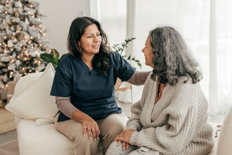 Registered Nurse and senior woman in assisted home