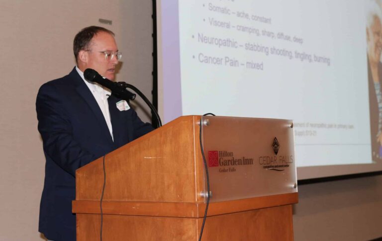 Man Presenting at Podium